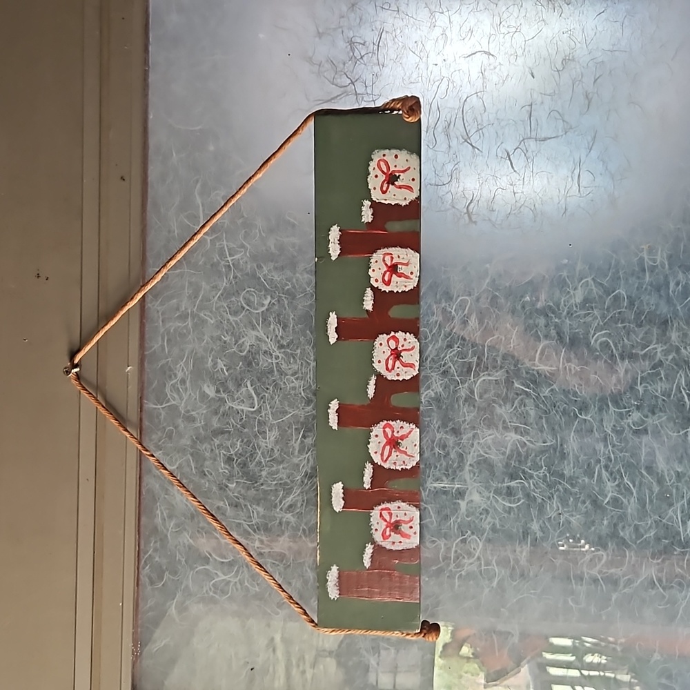 Hand painted wood Ho Ho Ho sign.
